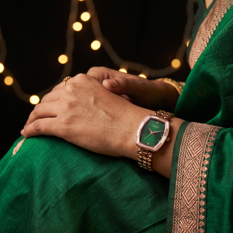 CN-525 emerald green watch worn with an emerald saree, string lights behind
