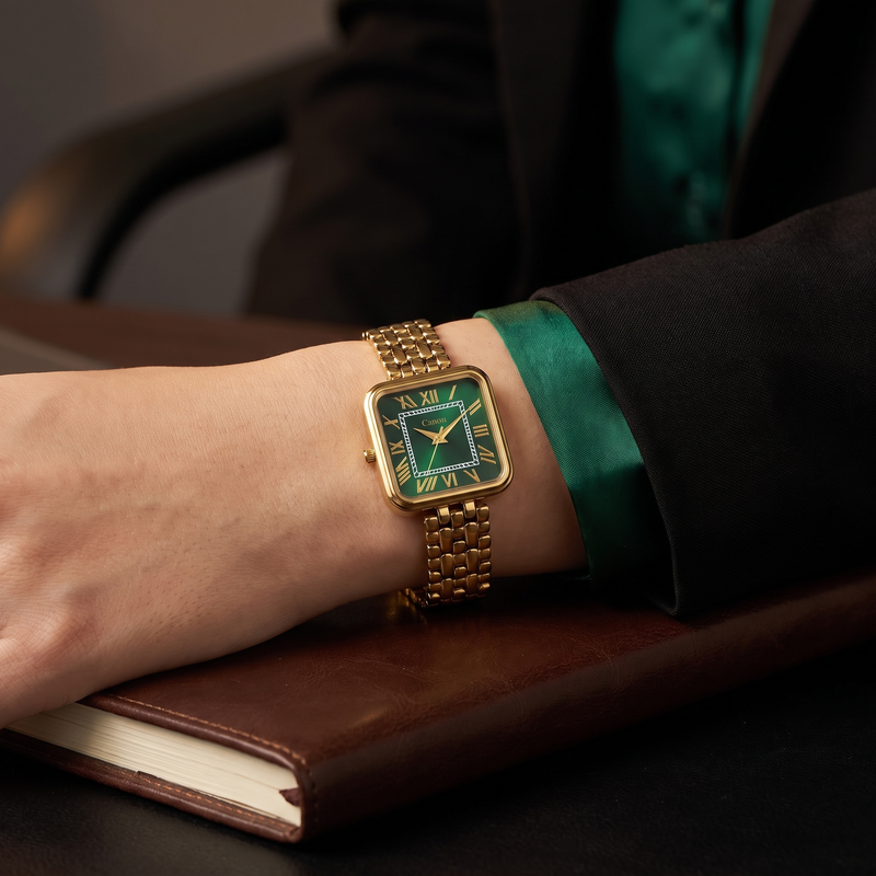 Woman in black blazer and emerald blouse wearing CN-532 at a desk