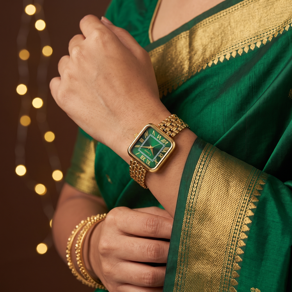 CN-532 worn with an emerald silk saree and gold bangles