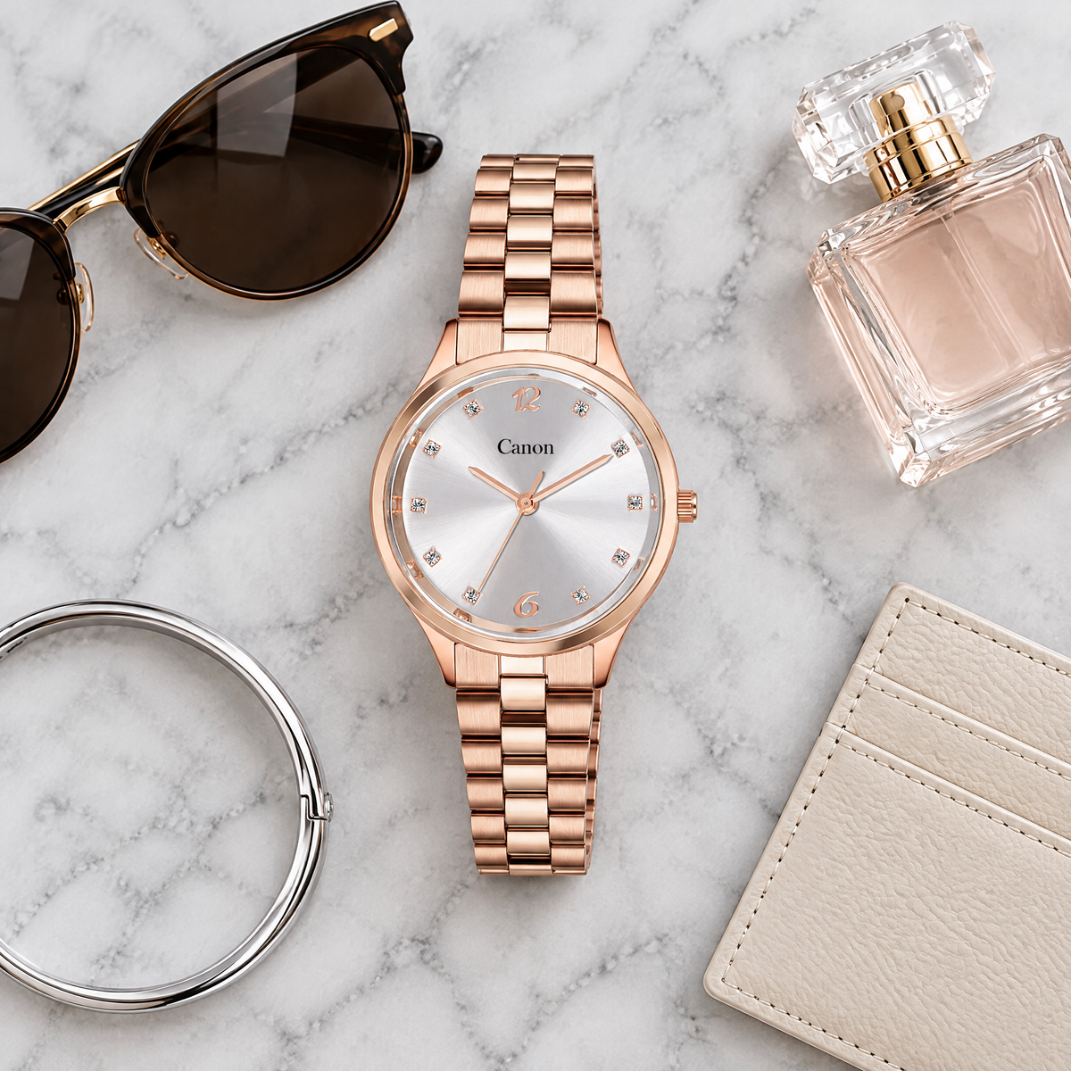 CN-530 flat-lay on marble with sunglasses and perfume